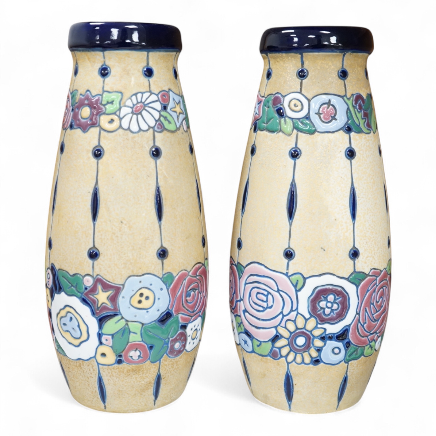 A pair of pottery Czech Amphora Art Deco pottery vases, with unusual high enamel stylised floral pattern, stamped Amphora to base, 31cm high